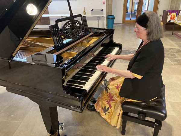 Marsha Head at the new piano in Stoke Damerel Church